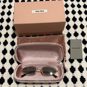Miu Miu Gold Frame Sunglasses with Black Lenses